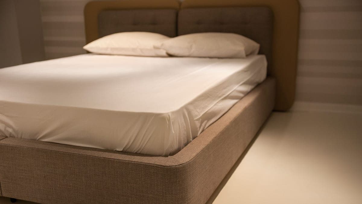 The corner of a mattress, showing its full thickness