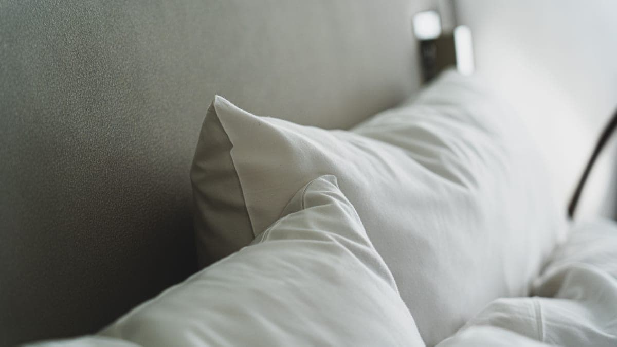 Pillows stacked against the head of a bed